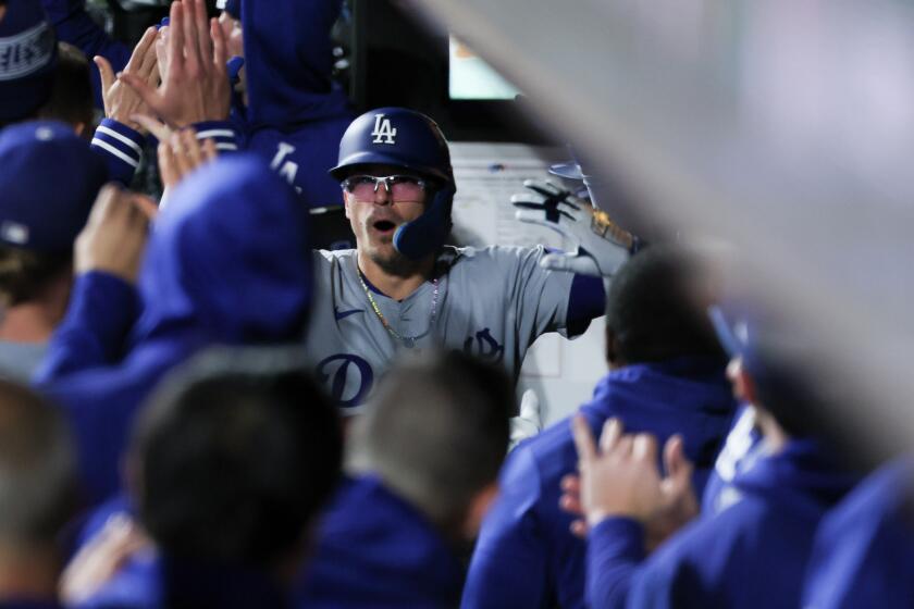 NEW YORK, NEW YORK - OCTOBER 16: Enrique Hernandez #8 of the Los Angeles Dodgers celebrates with the dugout after a two-run home run during the sixth inning in game three of the National League Championship Series against the New York Mets at Citi Field on Wednesday, Oct. 16, 2024 in New York. (Robert Gauthier / Los Angeles Times)