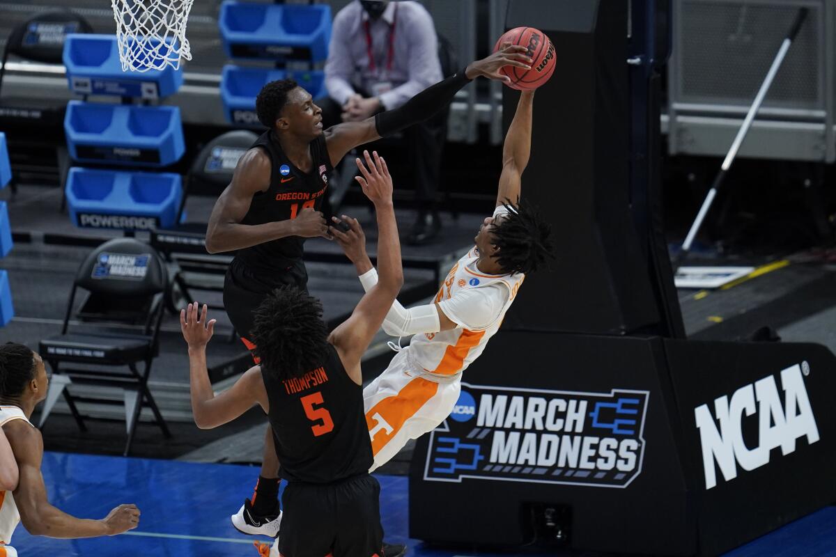 Oregon State forward Warith Alatishe blocks a shot by Tennessee guard Keon Johnson during the first half of Friday's game.
