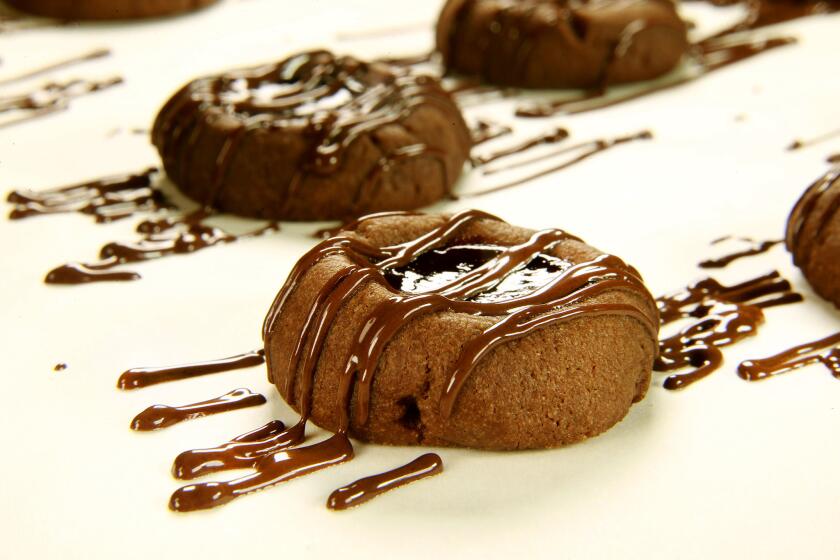 LOS ANGELES, CA., OCTOBER 11, 2016 -- Chocolate raspberry thumbprint cookies with chocolate drizzle to go with a cookbook review. (kirk McKoy / Los Angeles Times)