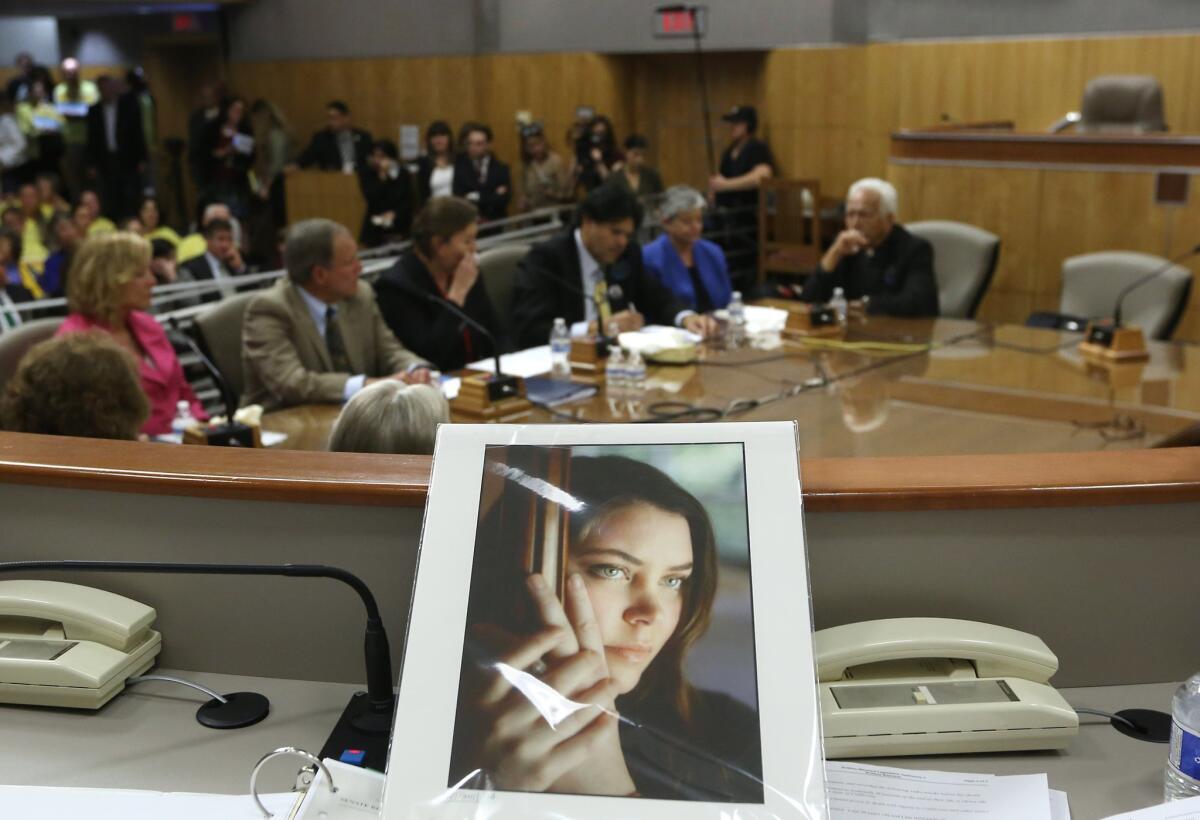 A photo of Brittany Maynard sits in the Senate Health Committee in Sacramento on March 25, as lawmakers took testimony on proposed legislation allowing doctors to prescribe life ending medication to terminally ill patients. Maynard, a 29-year-old San Francisco Bay Area woman who had terminal cancer, moved to Oregon where she could legally end her life.