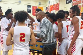 Fairfax coach Reggie Morris Jr. talking to his team earlier this season.