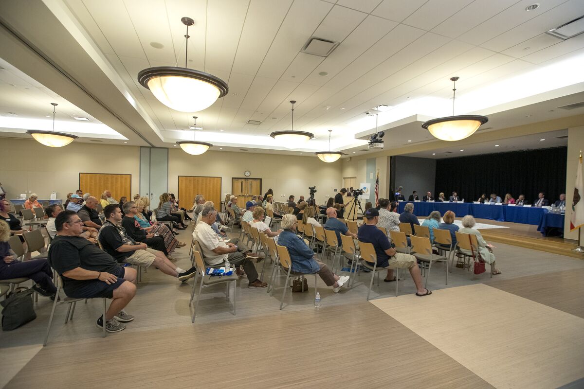 A crowd listens during a Huntington Beach City Council candidates forum on Wednesday in Huntington Beach.