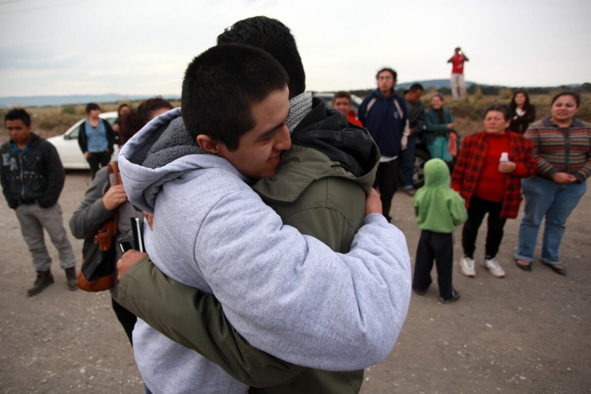 Juan Daniel Lopez Avila, left, is embraced by a relative after he was released from a maximum-security federal prison in Villa Aldama, Mexico, on Saturday.