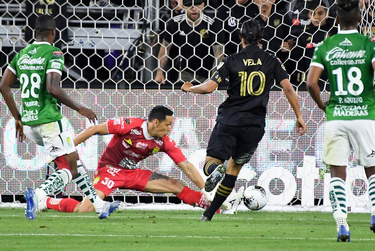 LAFC's Carlos Vela scores a goal against León in the second half of a CONCACAF Champions League match.