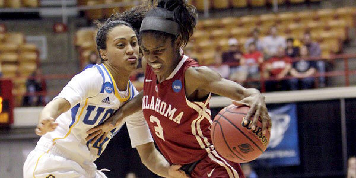 Oklahoma's Aaryn Ellenberg brings the ball up court as UCLA's Mariah Williams defends during the Sooners' NCAA tournament victory over the Bruins, 85-72.