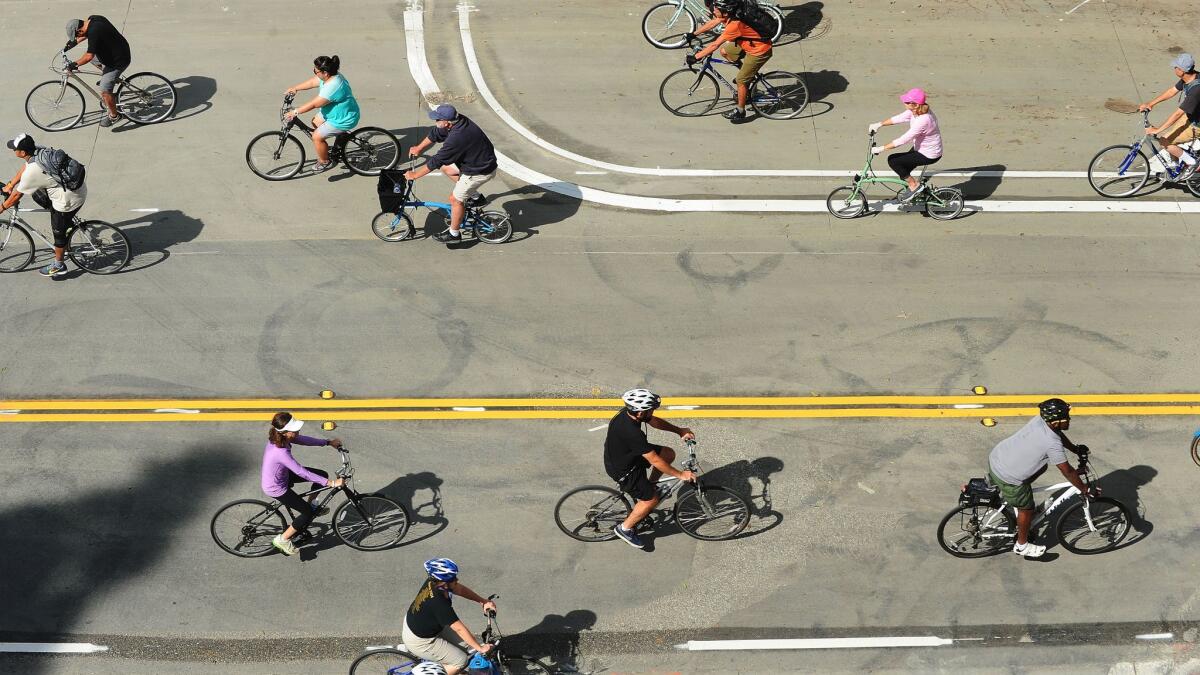 Bikes zip through downtown Los Angeles in 2016 during the CicLAvia festival, which returned Sunday in the city's Harbor region.