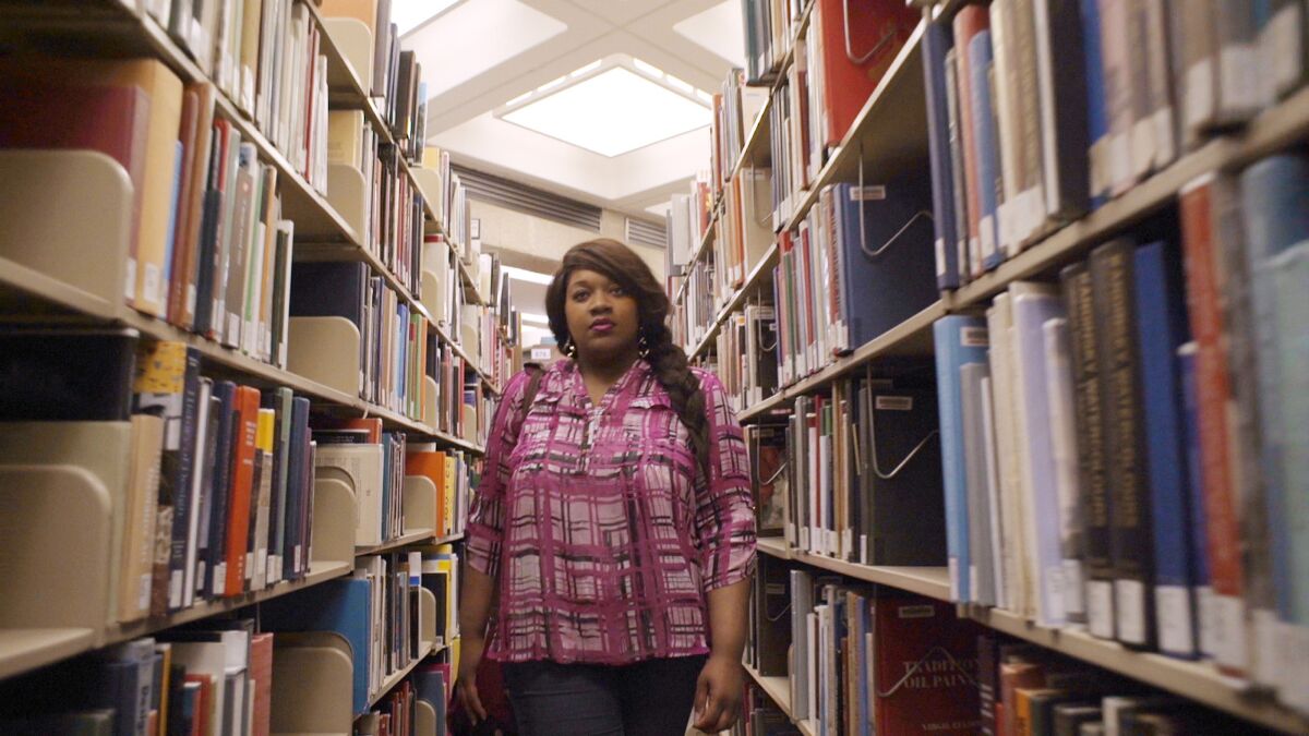 College student Clarissa in a library in the documentary 'Unlikely'