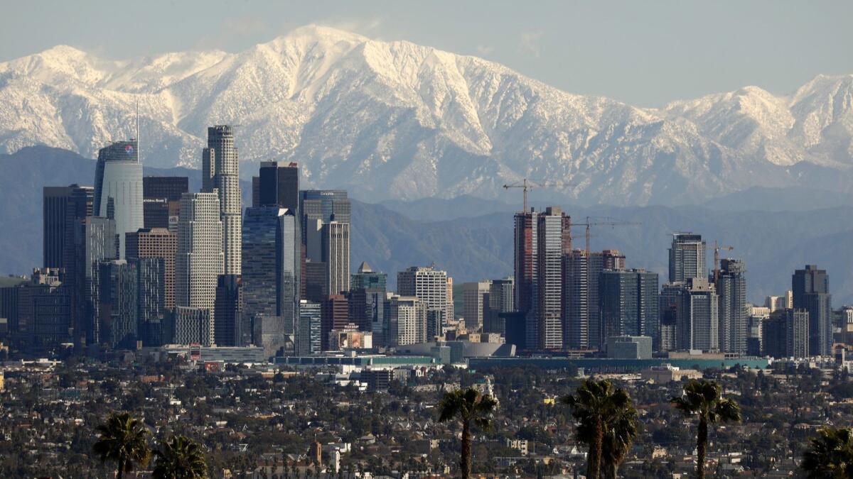 San Gabriel mountains covered with snow are a rare but beautiful backdrop above downtown Los Angeles earlier this month.