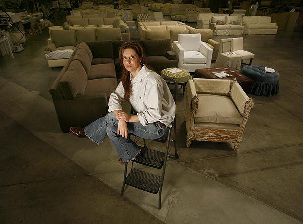 The recession has cut Quatrine Custom Furniture's sales volume about in half. "I believe we'll make it," owner Gina Quatrine says.