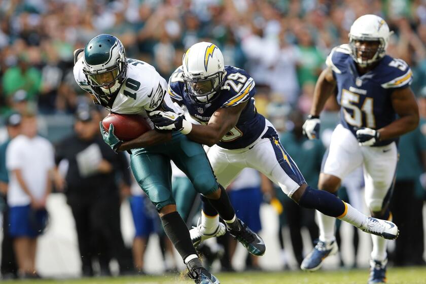 Philadelphia wide receiver DeSean Jackson, left, is taken down by San Diego cornerback Shareece Wright during the fourth quarter of the Chargers' 33-30 win in 2013.