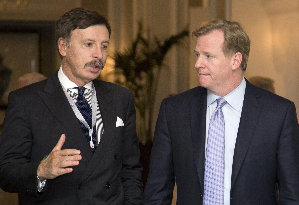NFL Commissioner Roger Goodell, right, with St. Louis Rams owner and would be L.A. football impresario Stan Kroenke. If you want to know Goodell's salary going forward, you may have to guess.