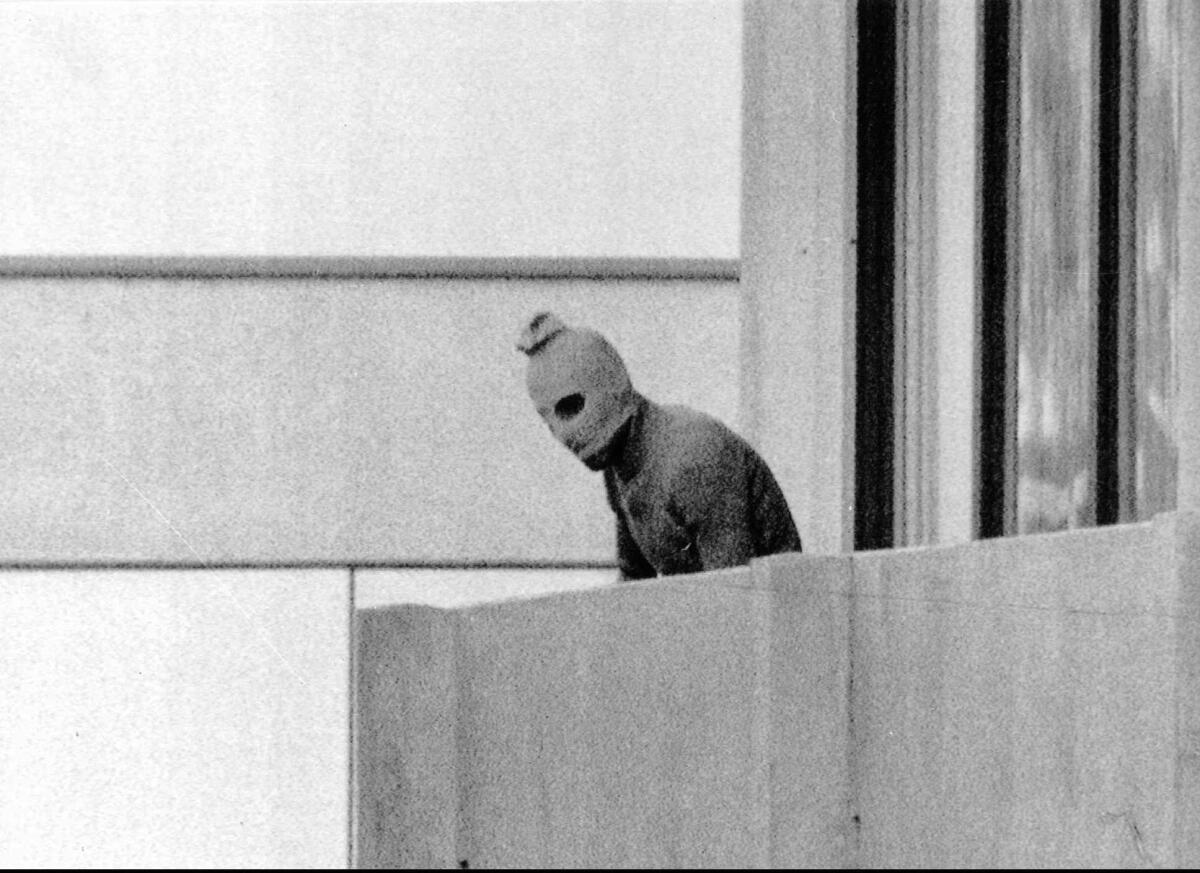A terrorist appears on a terrace at the Olympic village in Munich in 1972, when 11 Israelis were killed.