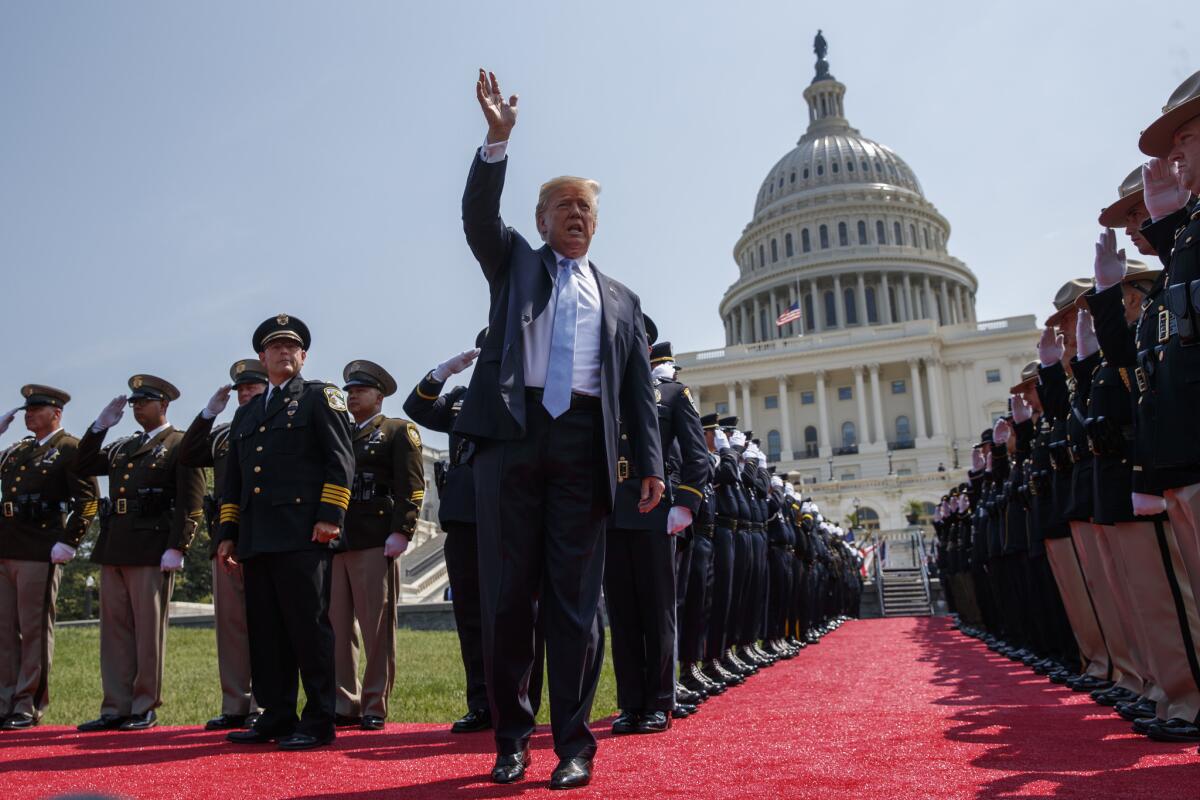 President Trump waves as he arrives for the 37th annual National Peace Officers Memorial Service Tuesday in Washington.