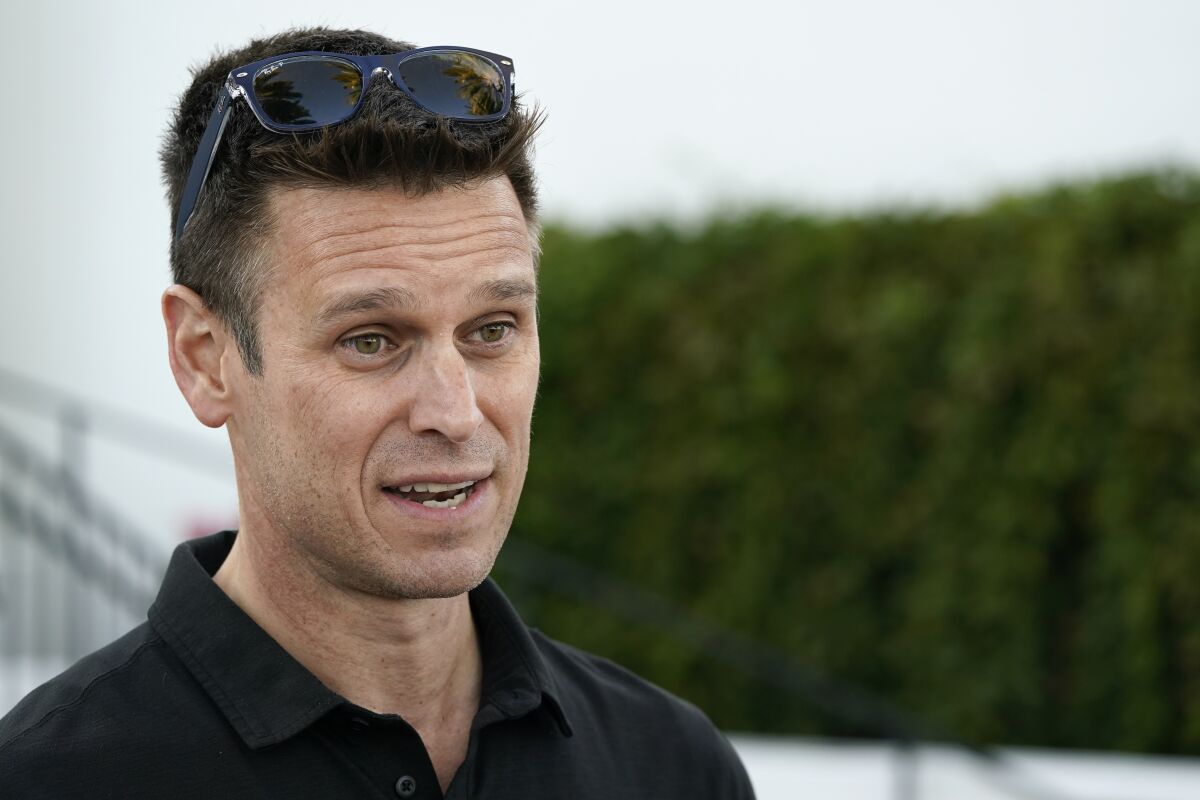 Seattle Mariners general manager Jerry Dipoto talks with reporters during Major League Baseball's GM Meetings Tuesday, Nov. 9, 2021, in Carlsbad, Calif. (AP Photo/Gregory Bull)