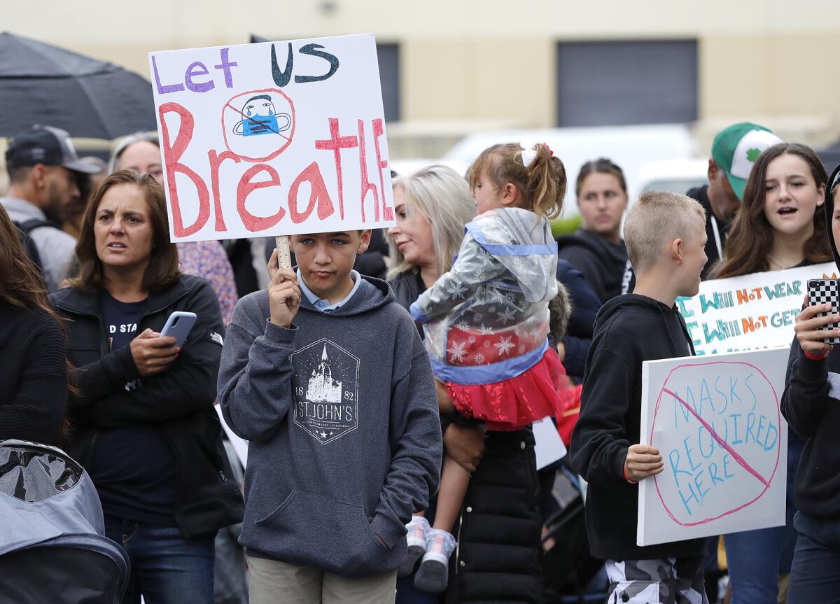 Chase Beamish, 12, at a rally Monday  in Costa Mesa, where attendees asked for a mask mandate to be lifted in O.C. schools.