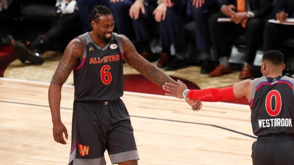 Western Conference teammates Russell Westbrook (0) and DeAndre Jordan (6) slap hands after a play against the Eastern Conference during the NBA All-Star Game on Feb. 19.