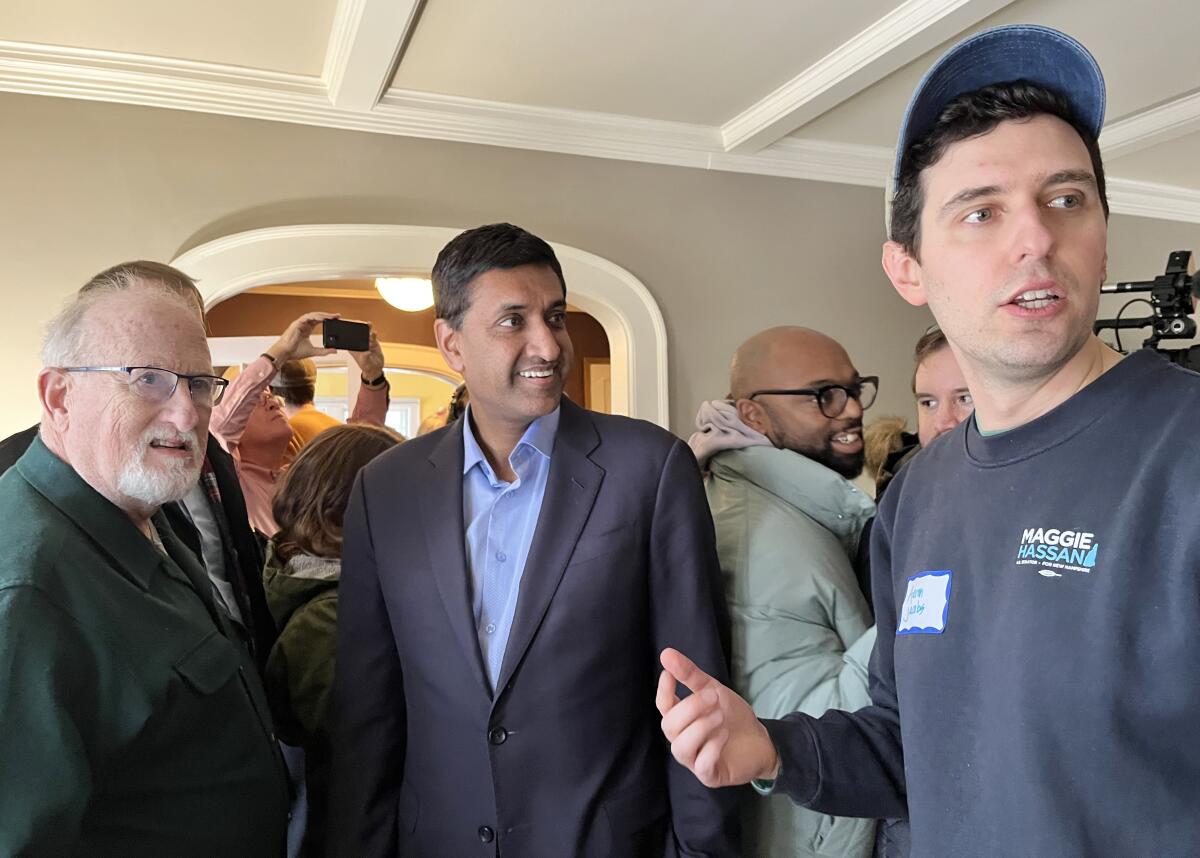 Rep. Ro Khanna speaks to people at a home.