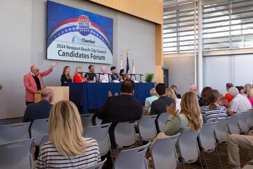 Candidates and residents applaud at the conclusion of the Newport Beach's first City Council Candidate Forum.