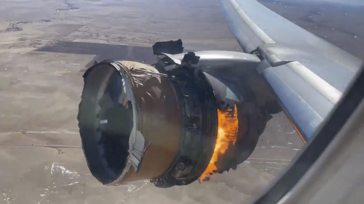 In this image taken from video, the engine of United Airlines Flight 328 is on fire after after experiencing "a right-engine failure" shortly after takeoff from Denver International Airport, Saturday, Feb. 20, 2021, in Denver, Colo. The Boeing 777 landed safely and none of the passengers or crew onboard were hurt. (Chad Schnell via AP)