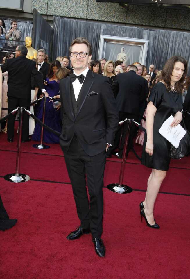Although Oldman ultimately went home without an Oscar, he ranks toward the top of our best-dessed men with his choice of a Paul Smith Bespoke tuxedo, a three-piece number in black mohair with a notch-lapel jacket with midnight blue contrast taping that was an exercise in George Smiley-worthy subtlety, and accented with a polka-dot pocket square.