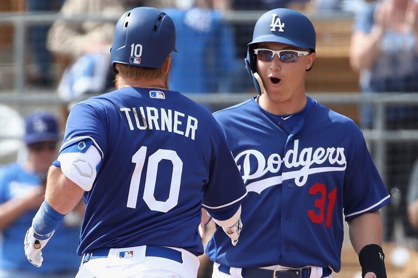 GLENDALE, ARIZONA - FEBRUARY 25: Joc Pederson #31 of the Los Angeles Dodgers celebrates Justin Turner #10 after Turner hit a two-run home run against the Chicago Cubs during the first inning of the MLB spring training game at Camelback Ranch on February 25, 2019 in Glendale, Arizona. (Photo by Christian Petersen/Getty Images) ** OUTS - ELSENT, FPG, CM - OUTS * NM, PH, VA if sourced by CT, LA or MoD **