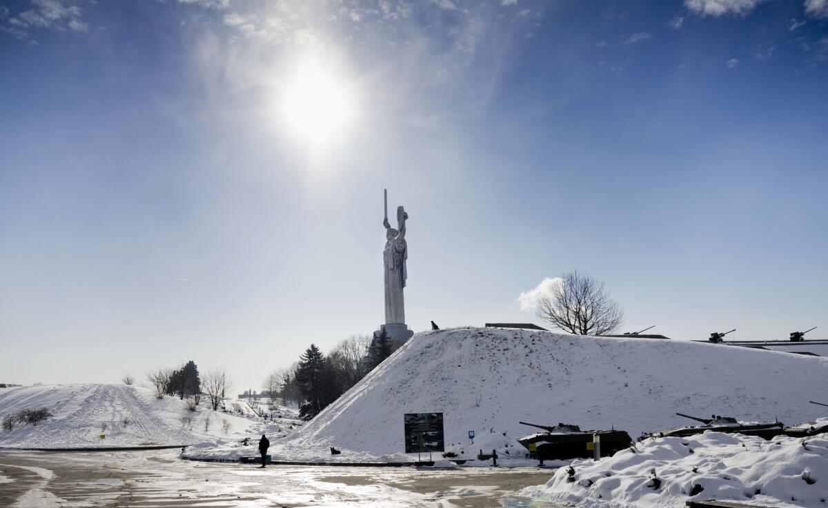 A visitor walks through a memorial park that is part of a World War II museum complex in Kiev, Ukraine.