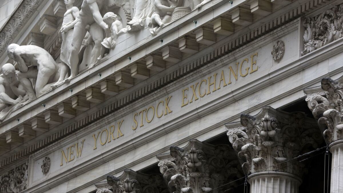 This Oct. 2, 2014, file photo shows the facade of the New York Stock Exchange. 