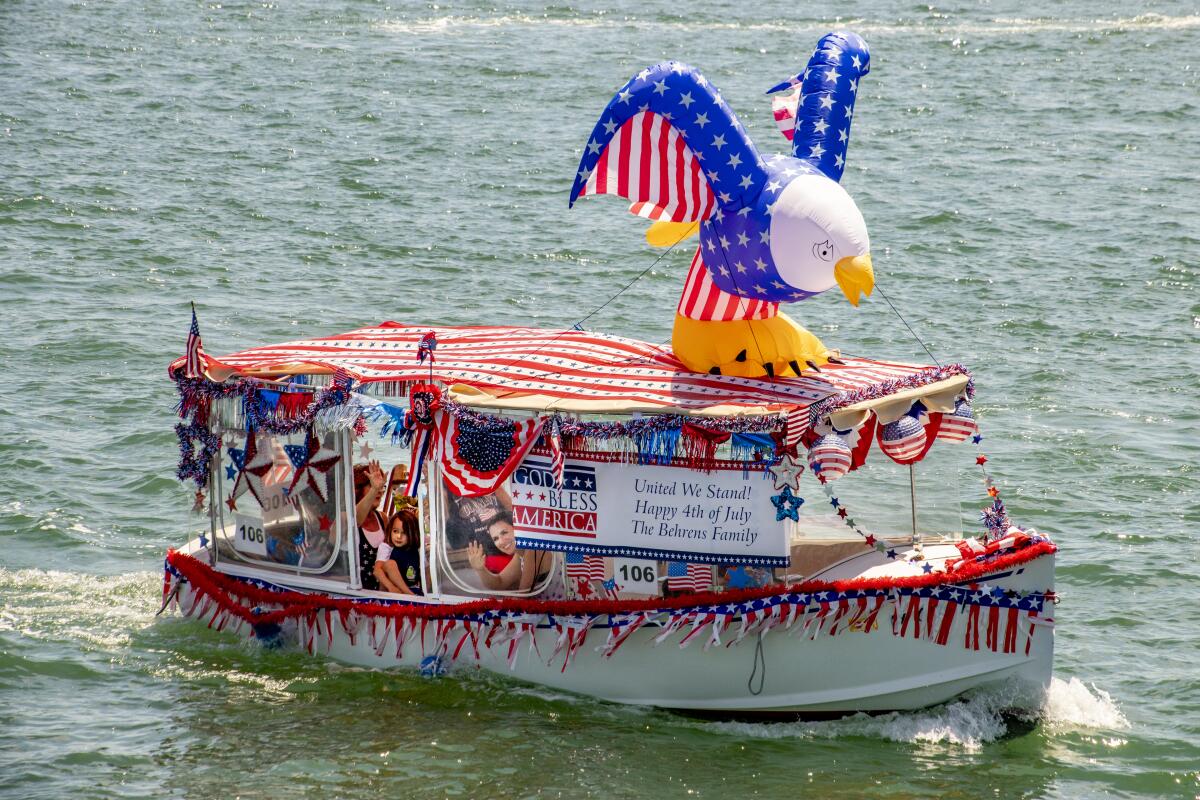 The Behrens family have their own American eagle in the Old Glory Boat Parade on July 4.