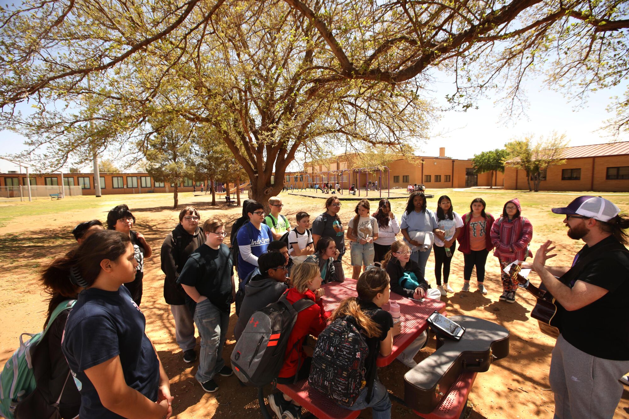 Johnathon Jowers conducts a Bible session to a group of students at Meadow School in Texas.