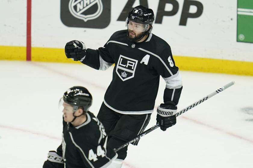 Los Angeles Kings defenseman Drew Doughty (8) celebrates a 3-1 win over the New York Rangers after their NHL hockey game Monday, Jan. 10, 2022, in Los Angeles. (AP Photo/Ashley Landis)