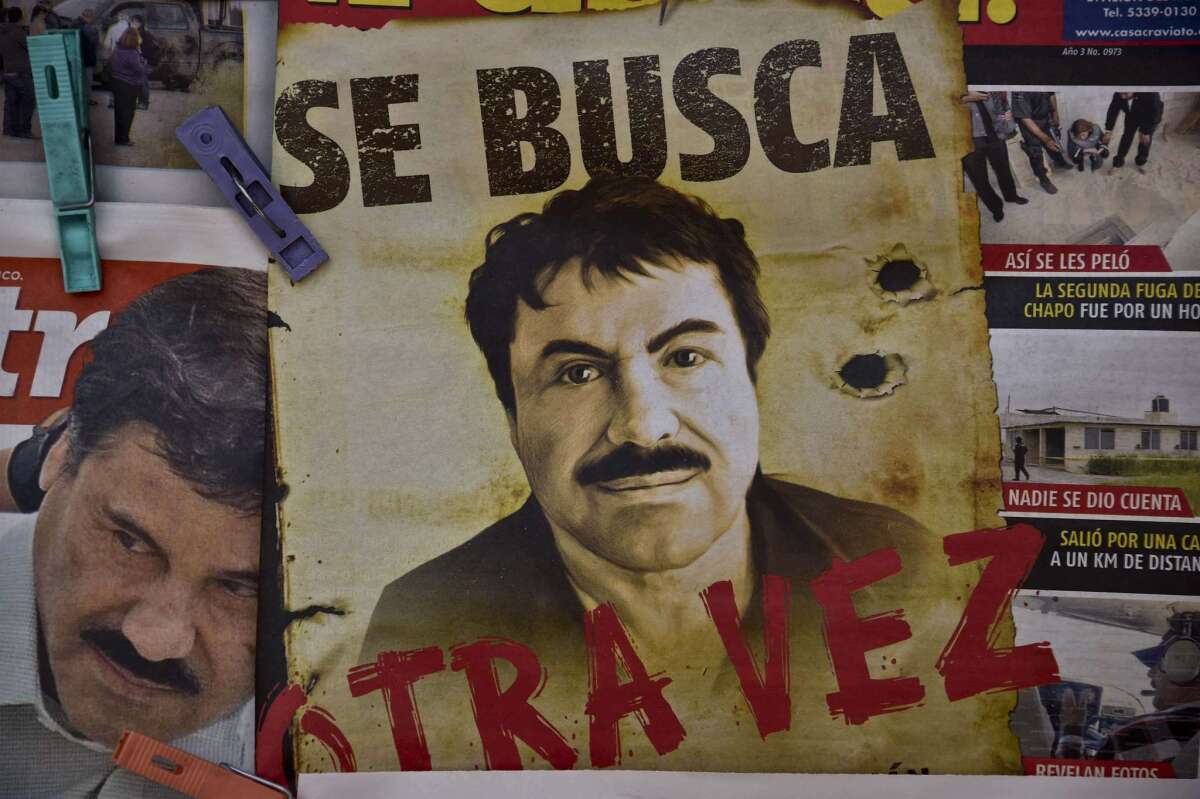A poster with the face of Mexican drug lord Joaquin "El Chapo" Guzman, reading "Wanted, Again", is displayed at a newsstand in one Mexico City's major bus terminals on July 13, 2015, a day after the government informed of the escape of the drug kingpin from a maximum-security prison.