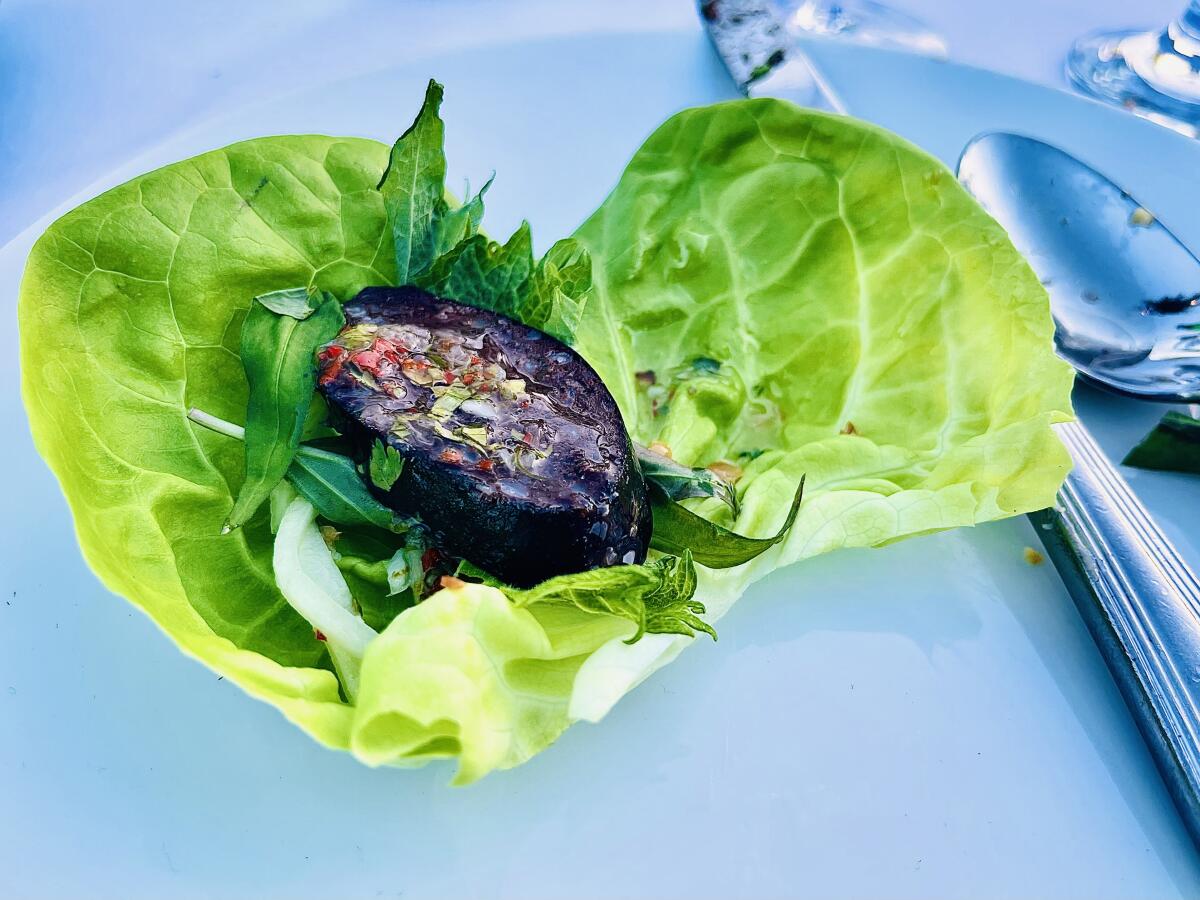 Blood sausage wrapped in lettuce.