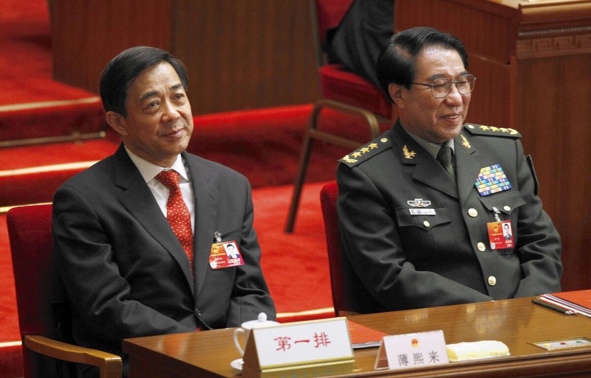 Chongqing Communist Party Secretary Bo Xilai, left, and Xu Caihou, a former vice chair of the Central Military Commission, in 2012. Bo was sentenced last year to a life term on corruption and other charges; Xu has been accused of taking bribes and was kicked out of the party last week.