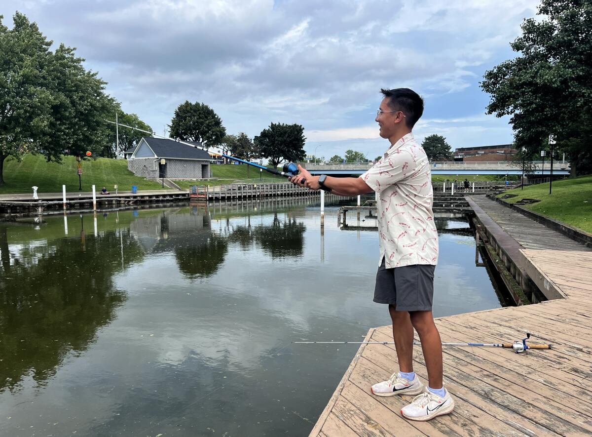 Raffy Castro fishes in the Clinton River