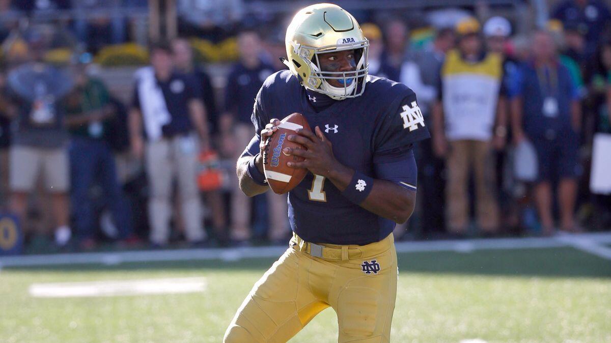 Notre Dame quarterback Brandon Wimbush rolls out to pass during the first half of a game against Miami (Ohio) on Saturday.