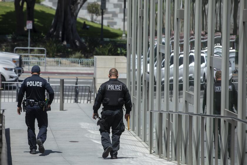 LOS ANGELES, CA - JUNE 03, 2021: Members of the LAPD leave LAPD Headquarters on 1st St. in downtown Los Angeles. (Mel Melcon / Los Angeles Times)