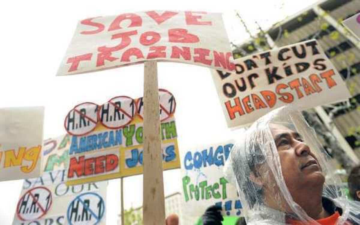 Protesters in Los Angeles march in 2011 against federal budget cuts. Scientists have expressed concern about 2013 cuts.