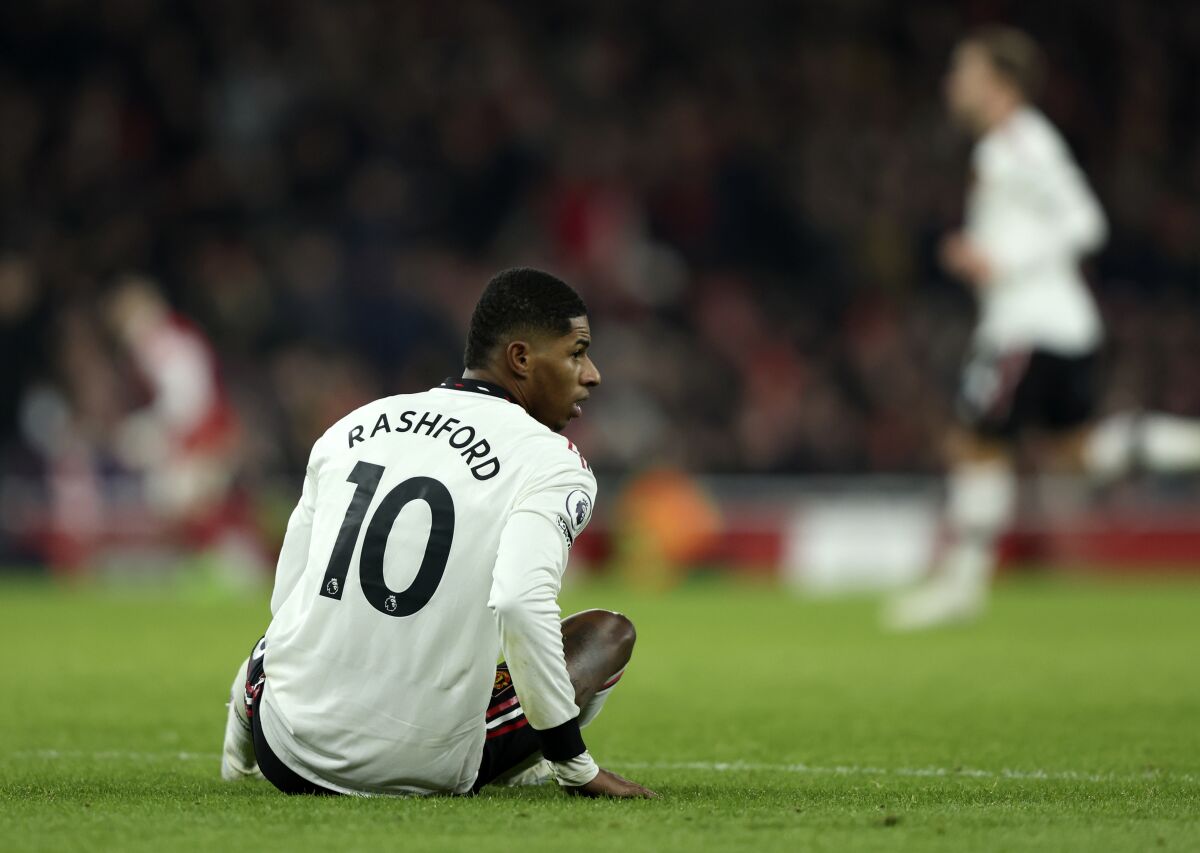 Manchester United's Marcus Rashford reacts after sustaining an injury during the English Premier League soccer match between Arsenal and Manchester United at Emirates stadium in London, Sunday, Jan. 22, 2023. (AP Photo/Ian Walton)
