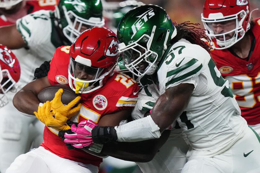 Kansas City Chiefs running back Clyde Edwards-Helaire (25) carries the ball against New York Jets linebacker C.J. Mosley (57) during the first quarter of an NFL football game, Sunday, Oct. 1, 2023, in East Rutherford, N.J. (AP Photo/Frank Franklin II)