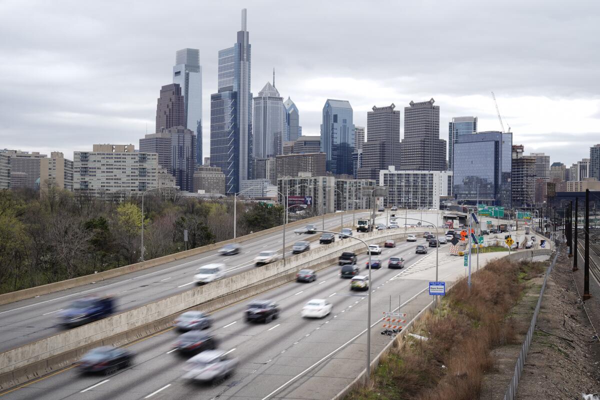 FILE - Traffic moves along the Interstate 76 highway on March 31, 2021, in Philadelphia. Two new U.S. studies released Tuesday, Nov. 15, 2022, show that automatic emergency braking can cut the number of rear-end automobile crashes in half, and reduce pickup truck crashes by more than 40%. (AP Photo/Matt Rourke, File)