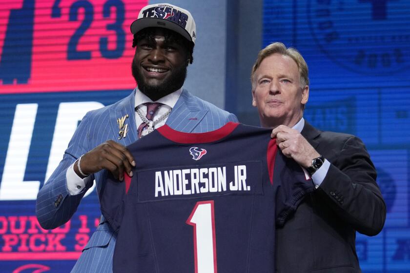 FILE - Alabama linebacker Will Anderson Jr. poses with NFL Commissioner Roger Goodell after being chosen by the Houston Texans with the third overall pick during the first round of the NFL football draft, Thursday, April 27, 2023, in Kansas City, Mo. Anderson and New Orleans Saints edge rusher Chase Young joined Klutch Athletics founder Rich Paul this week for the reveal of New Balance’s first football cleats. (AP Photo/Jeff Roberson, File)