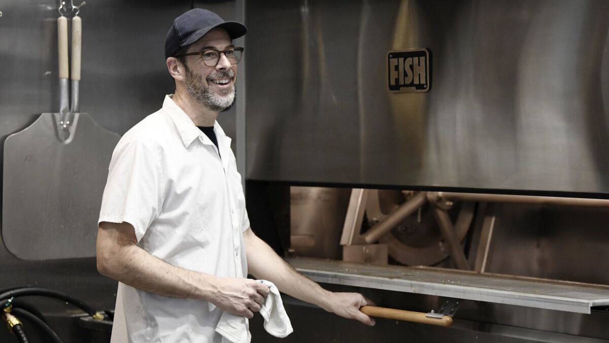 Jason Kaplan, baker and owner of Maury's Bagels, making bagels at his new bakery.