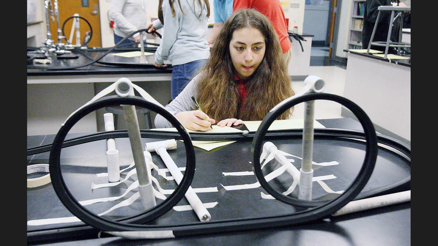 Photo Gallery: 8th grade Theodore Roosevelt Middle School students make roller coasters in physical science class