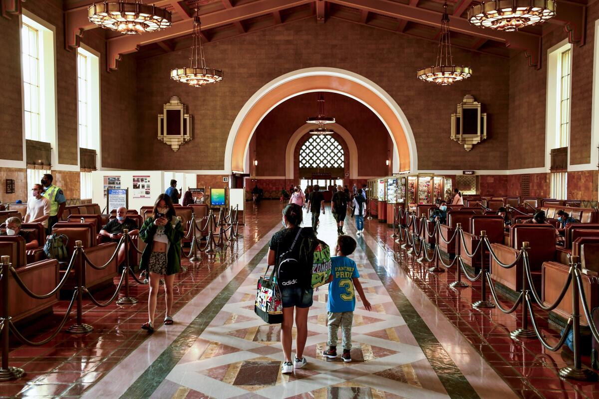 People walk through the interior of Union Station