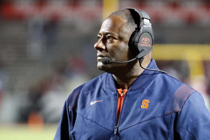 Syracuse head coach Dino Babers watches from the sideline during the second half of an NCAA college football game against North Carolina State in Raleigh, N.C., Saturday, Nov. 20, 2021. (AP Photo/Karl B DeBlaker)