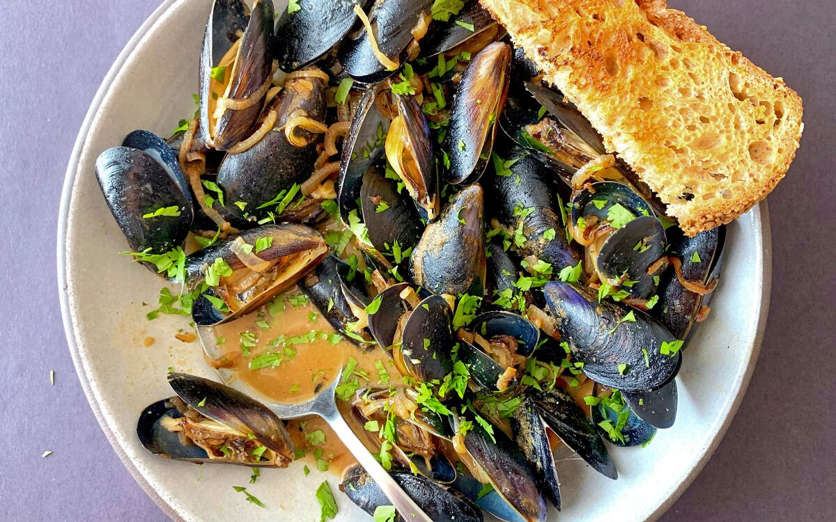 Miso and charred shallots add flavor and body to a rosé wine broth for steaming mussels in this dinner for one.