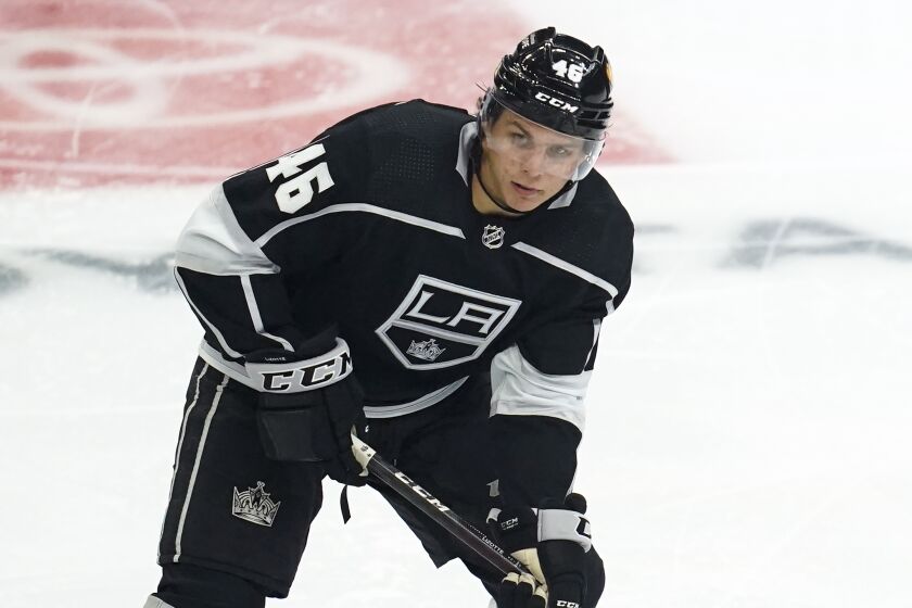 Los Angeles Kings center Blake Lizotte (46) controls the puck during the first period.