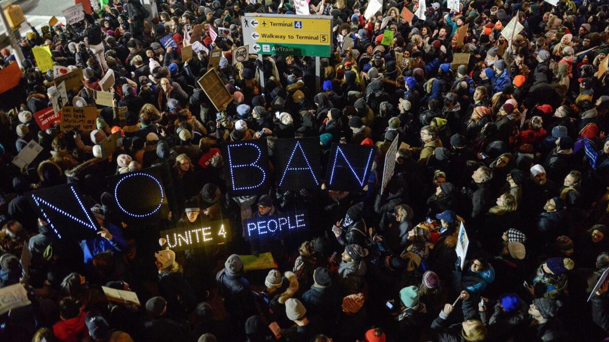 Protesters demonstrate at John F. Kennedy International Airport in New York City on Saturday.