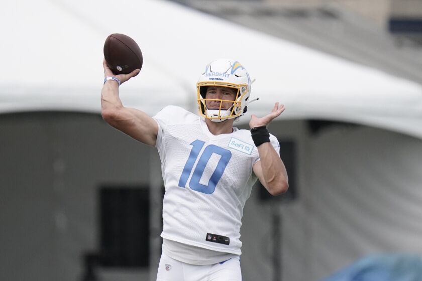 Los Angeles Chargers quarterback Justin Herbert throws a pass during an NFL football camp practice, Monday, Aug. 17, 2020, in Costa Mesa, Calif. (AP Photo/Jae C. Hong)