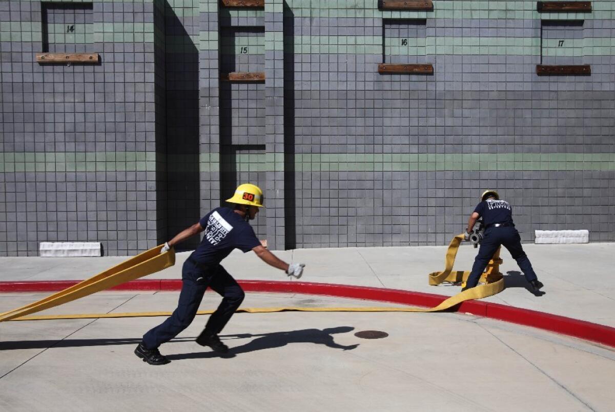Los Angeles Fire Department recruits participate in a training exercise in Panorama City.